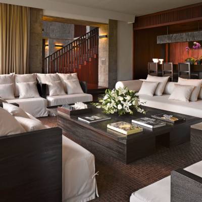 a living room filled with furniture and a large window