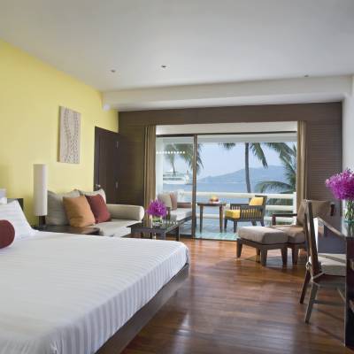 a bedroom with a large bed in a hotel room