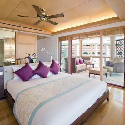 a bedroom with a large bed in a room