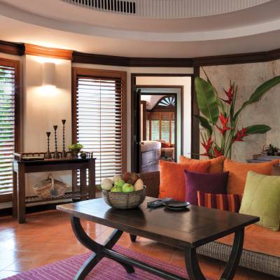 a living room filled with furniture and a large window
