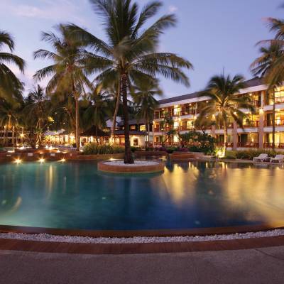a large body of water surrounded by palm trees