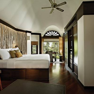 a living room filled with furniture and a large window