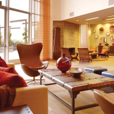 a living room filled with furniture and a fire place