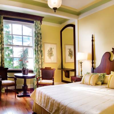 a bedroom with a large bed in a hotel room