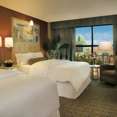 a bedroom with a large bed in a hotel room
