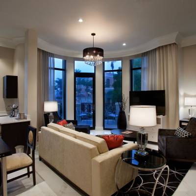 a living room filled with furniture and a large window