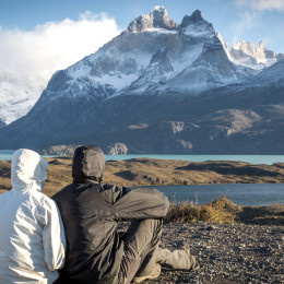 Young couple enjoying the a beautiful scenario in Torres del Paine National Park, Patagonia, Chile, South America
