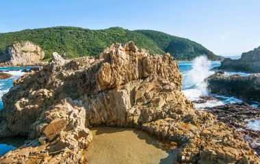 Knysna heads sunset, rocks shore, Indian Ocean, Garden Route, South Africa