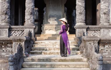 Vietnamese girl in long purple dress