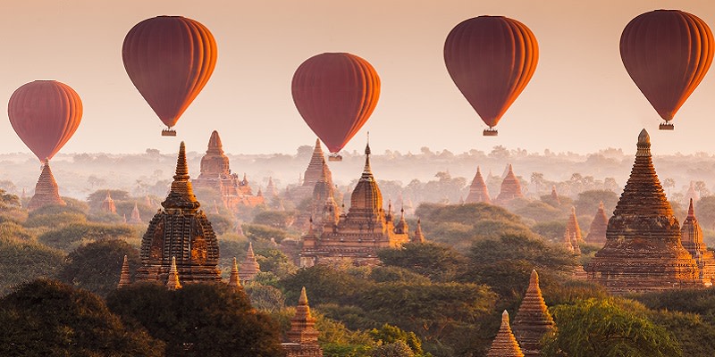 Enchanting Travels Asia Tours Hot air balloon over plain of Bagan at sunrise, Myanmar Balloon over Bagan, Myanmar