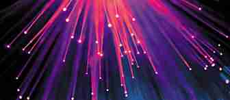 A display of colorful fiber optic lights emanating outward, creating streaks and points of vibrant pink, purple, and blue against a dark background. The lower part of the image features a bokeh effect with blue and pink glowing circles.