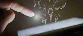 A finger is about to touch a glowing tablet screen, with various hand-drawn icons floating above the screen. The icons include a heart, a location pin, WiFi symbol, cloud, music note, bell, envelope, thumbs-up, and play button. The background is dark.