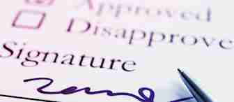 A close-up of a form with two checkboxes labeled "Approved" and "Disapproved." The "Approved" box is checked. Below is the word "Signature" with a cursive signature and a pen resting on the paper. The image is lit with a purple hue.