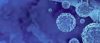 A highly magnified, digital illustration of cancer cells depicted in varying shades of blue. The cells appear spherical with irregular, spiky surfaces, set against a blurred blue background, highlighting cellular structure and division.