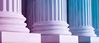 A close-up view of the base of large marble columns and steps, possibly part of a governmental or historic building. The image is tinted with a gradient of purple to blue hues, giving it a modern and stylized effect.