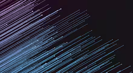 A digital illustration featuring diagonal light streaks in blue and pink shades against a dark, almost black, background. The streaks appear to be moving from the upper left to the lower right, creating a sense of motion and energy.