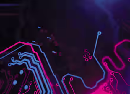 Abstract close-up of a circuit board with neon blue and pink lines and nodes on a dark background. The glowing lines create a dynamic, high-tech aesthetic with a futuristic feel.