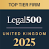 "Badge displaying 'Top Tier Firm' from Legal 500 United Kingdom for 2025, with gold and white text on a dark blue and gold background.
