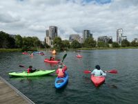 a group of people in kayaks on the west reservoir