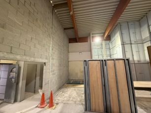The image shows the building work progress in the reception area of the centre