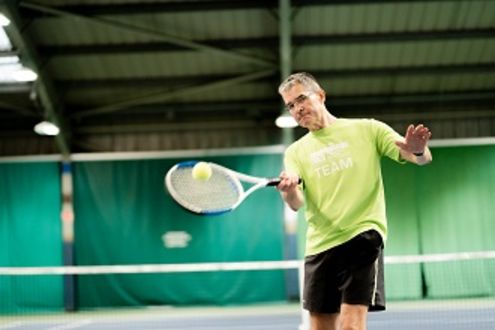 Adult male tennis player at ozone