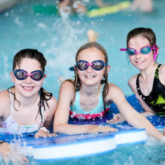 girls having fun in swimming pool