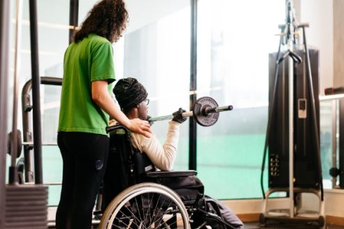 Woman on wheelchair in the gym