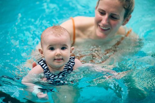 baby and woman in the pool