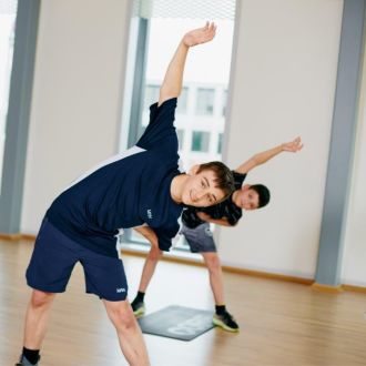 Junior members stretching in a fitness class
