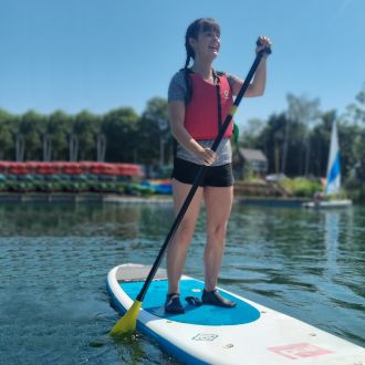 Girl on paddleboard on Stanborough Lake Girl on paddleboard on Stanborough Lake