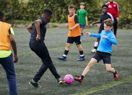 group of children playing football