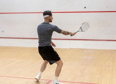 man playing squash