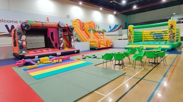 A photo of part of our revamped Inflatable zone, 3 of our inflatables, our softplay area, and seating