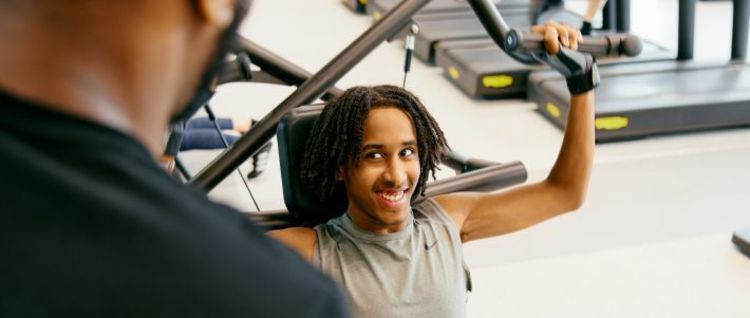 junior and adult on rowers together