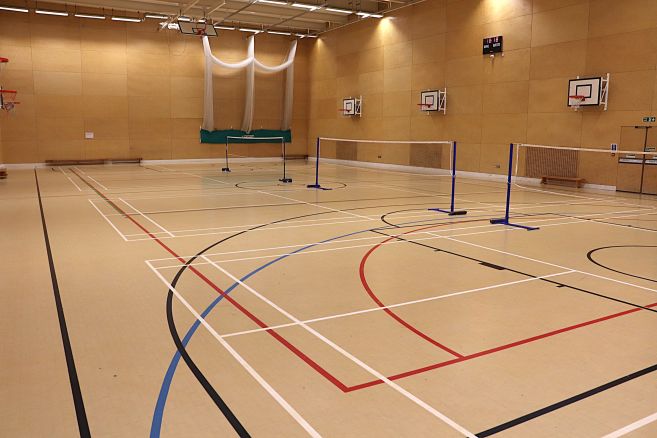 Indoor sports hall set up for badminton