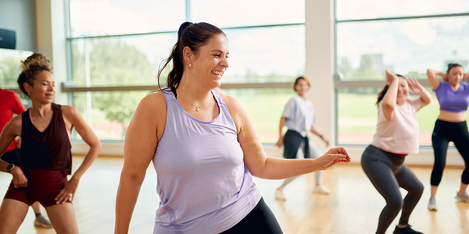 A woman working out in a dance class A woman working out in a dance class