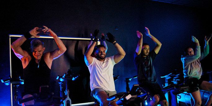 People working out in a group cycle class