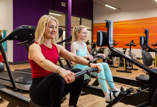 Female members on rowing machines