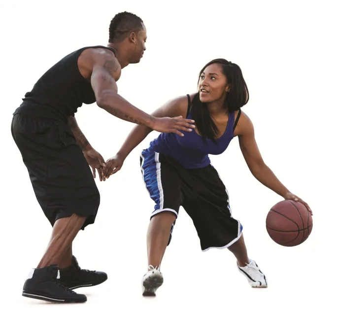 Man and women playing basketball 