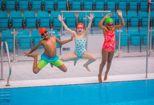kids jumping into a pool kids jumping into a pool