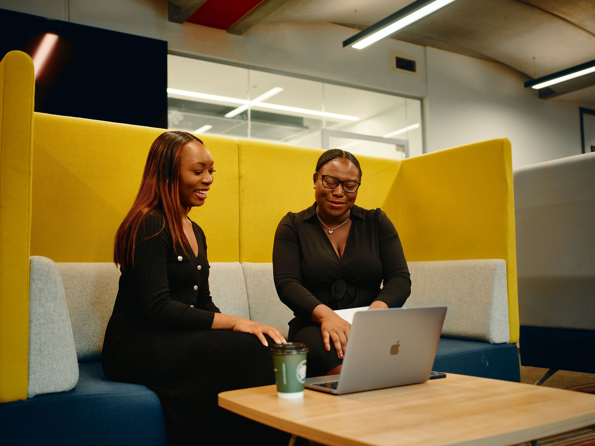 Two women in the library working Two women in the library working