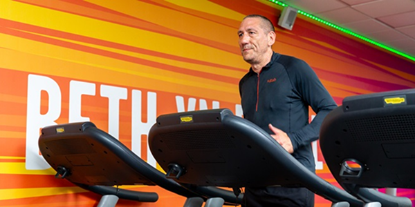 A man using a treadmill at the gym A man using a treadmill at the gym