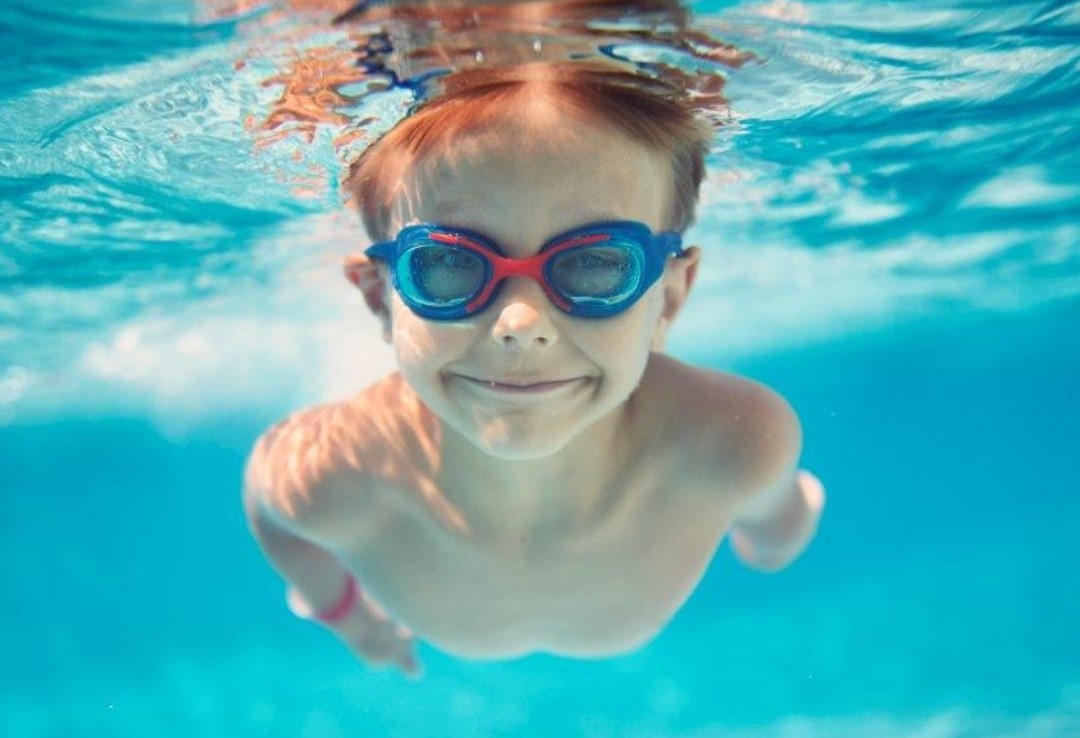 Boy swimming underwater Boy swimming underwater