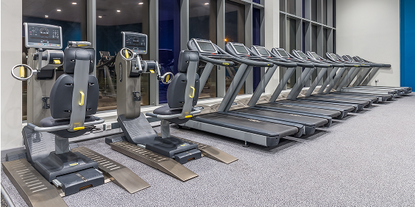 a view of the cardio gym at East Manchester with exercise machines a view of the cardio gym at East Manchester with exercise machines