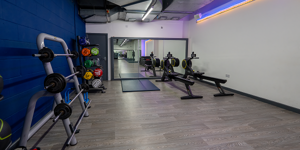 a view of the free weights and stretching area at Whalley Range gym a view of the free weights and stretching area at Whalley Range gym
