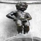 The Manneken Pis Statue in Brussels Urinating into a Fountain