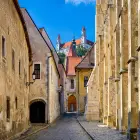 A Cobbled Street with Stone Buildings in Bratislava