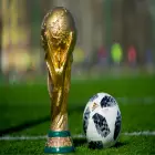Closeup of Fifa World Cup Trophy next to Football