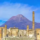 Ruins in Pompeii with Mount Vesuvius Behind Them