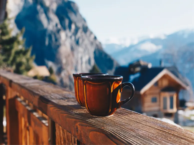 Coffee Mugs on Ledge with Interlaken Mountain Backdrop
